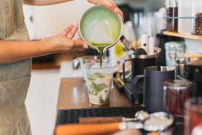 Midsection of woman preparing food