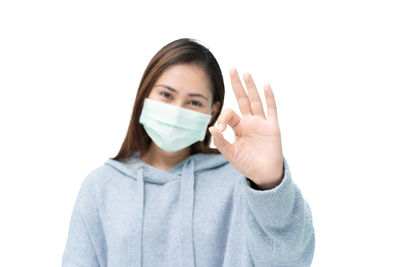 Portrait of a beautiful young woman over white background