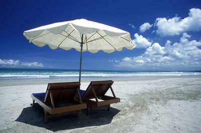 Sunshade over lounge chairs at beach