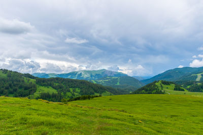 A picturesque landscape view of the french alps mountains on a cloudy summer day