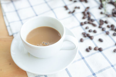 High angle view of coffee cup on table