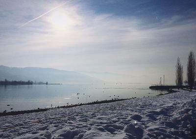 Scenic view of sea against cloudy sky
