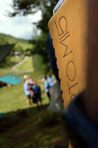 Close-up of people walking with text