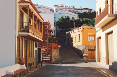 Houses against sky in city