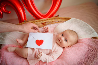 Valentine's day, little girl with valentine envelope