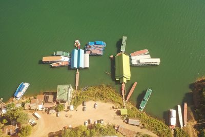 High angle view of buildings by sea in city