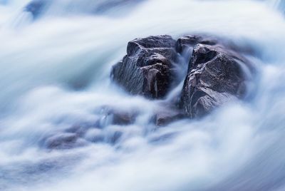 Close-up of water flowing through rocks