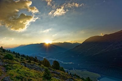 Scenic view of mountains against sky during sunset