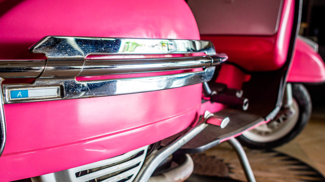 CLOSE-UP OF RED CAR