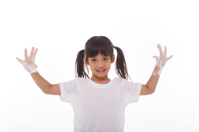 Portrait of a smiling girl over white background