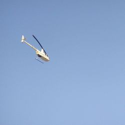 Low angle view of airplane flying in sky