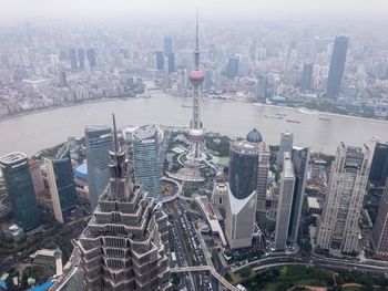 High angle view of city at riverbank