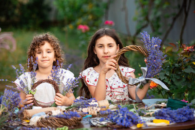 Portrait of smiling friends in greenhouse