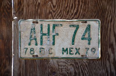 Close-up of text on wooden plank