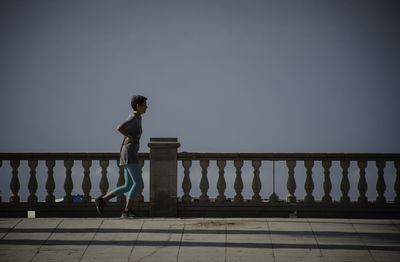 Low angle view of woman standing on steps