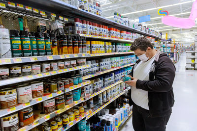 Full length of man looking at store