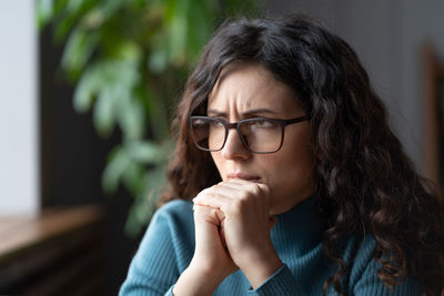 Nervous anxious business woman wait for job interview or exam result, try to solve problem at work