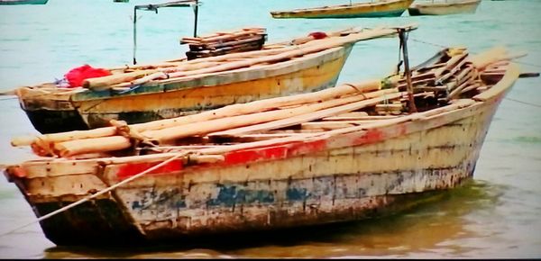 Fishing boats moored in sea