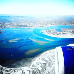 Scenic view of sea seen through airplane window