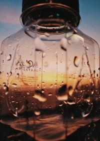 Close-up of wet glass bottle