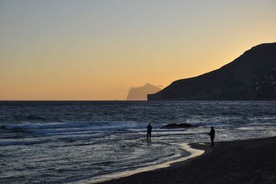 Scenic view of sea against clear sky during sunset