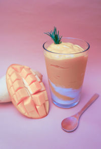 Close-up of mango smoothies in glass on table