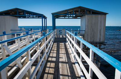 Pier over sea against sky