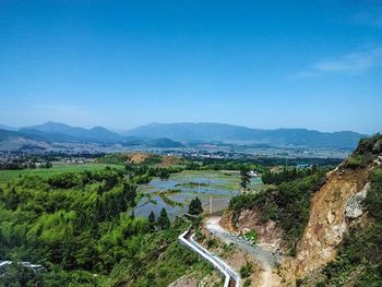 Scenic view of mountains against blue sky