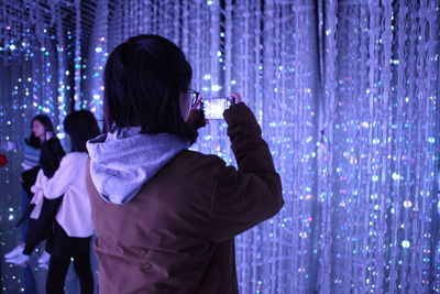 Woman holding mobile phone