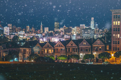 View of city lit up at night