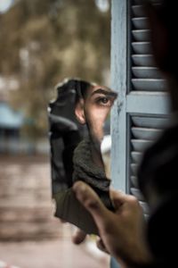 Portrait of man holding camera