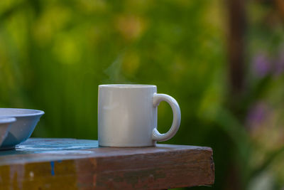 Close-up of coffee cup on table