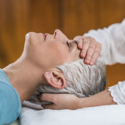 Close-up of woman getting massage at spa