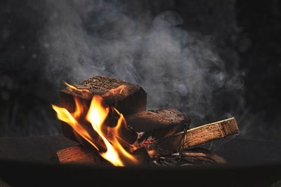 Close-up of burning fire on wood