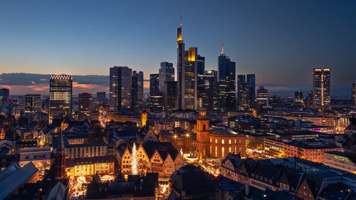 High angle view of illuminated buildings in city at night