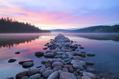 Scenic view of lake against sky during sunset