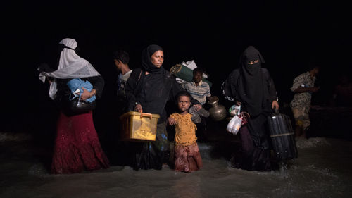 People standing at night