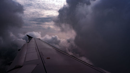 Low angle view of airplane flying in sky