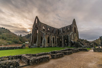 Old ruin building against cloudy sky