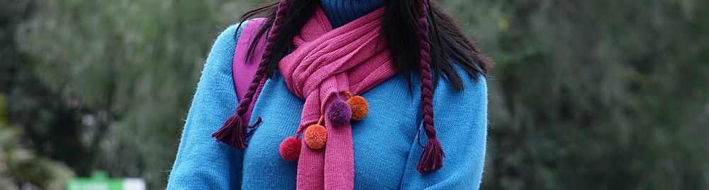 Close-up of multi colored tied up on rope