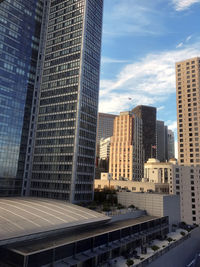 Modern buildings in city against sky