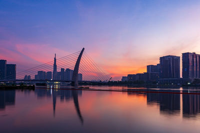 View of bridge over river against sky during sunset