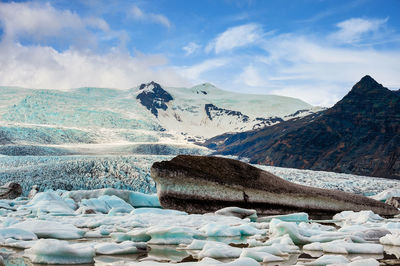 Scenic view of snowcapped mountains against sky