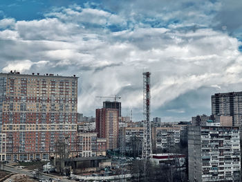 Modern buildings in city against sky