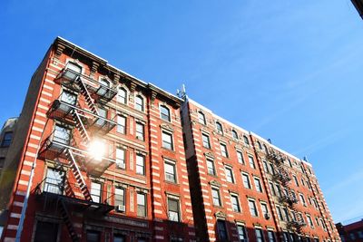 Low angle view of building against blue sky