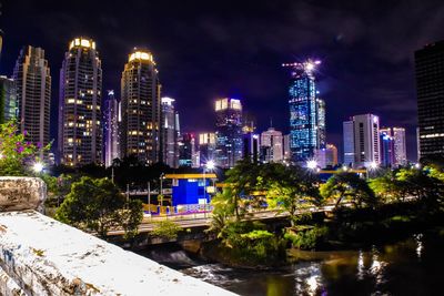 Illuminated buildings in city at night