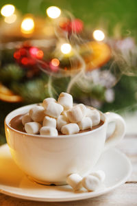 Close-up of marshmallows in coffee cup on table