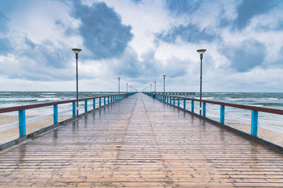 View of pier on sea against sky