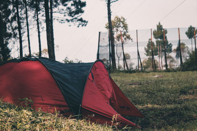 Tent on field against sky