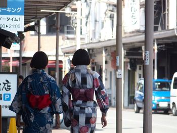 Traditionally dressed japanese women walking in the street 